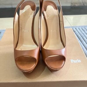 Tan Leather Christian Louboutin shoes. Red bottoms.